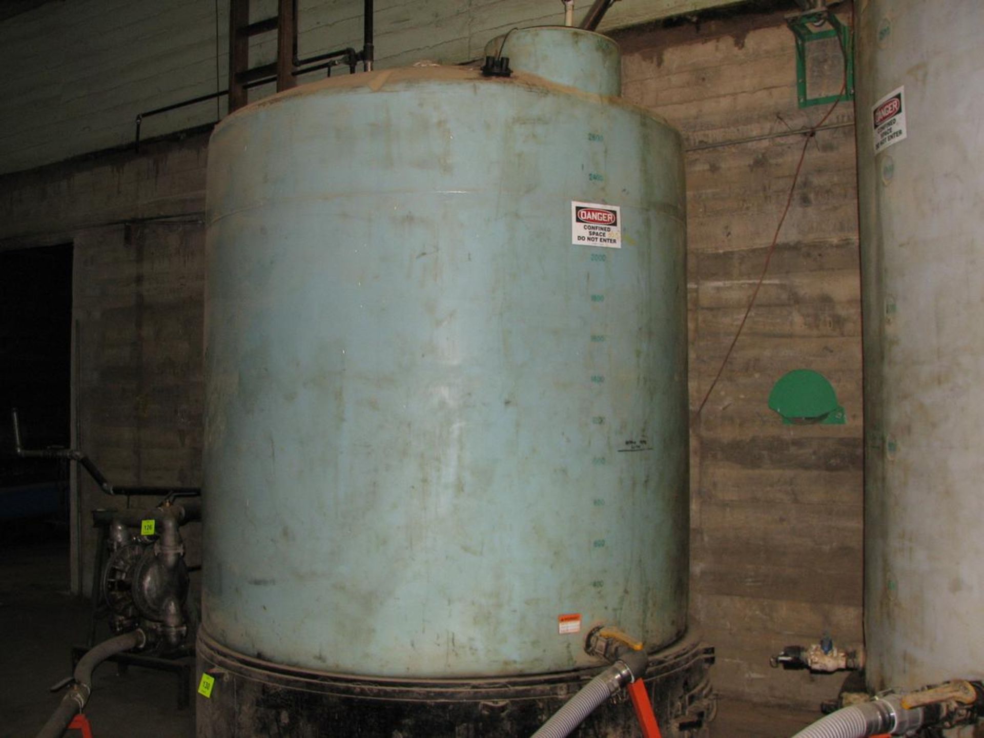 3,000 Gallon capacity vertical poly tank, 5' H x 8' dia. on 2 base flat bottom, dome top