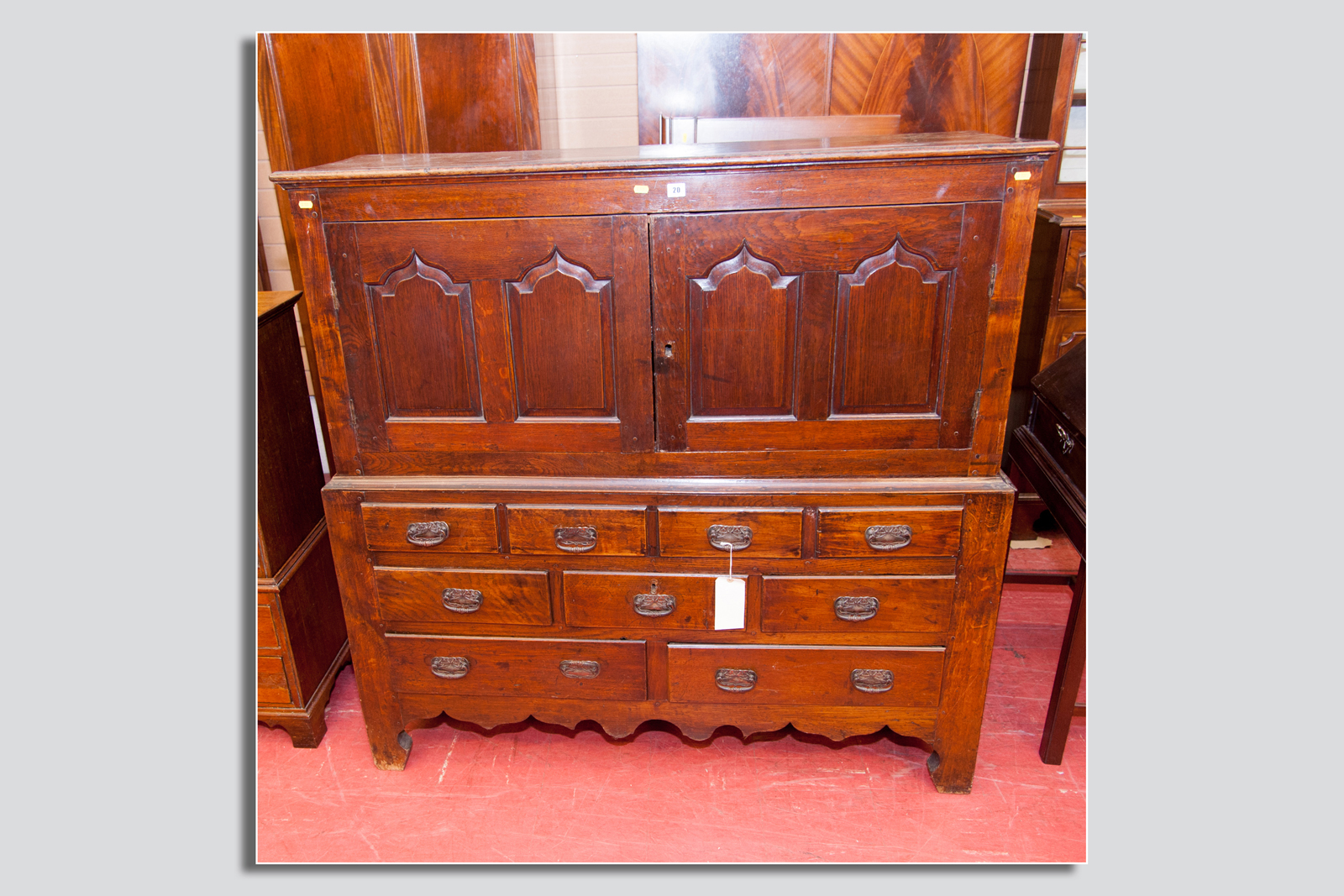 An early 19th Century oak Lancashire style chest having two opening doors and a base of five