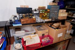 A large quantity of watch and clock repairer`s material to include clock spring coils, mercury