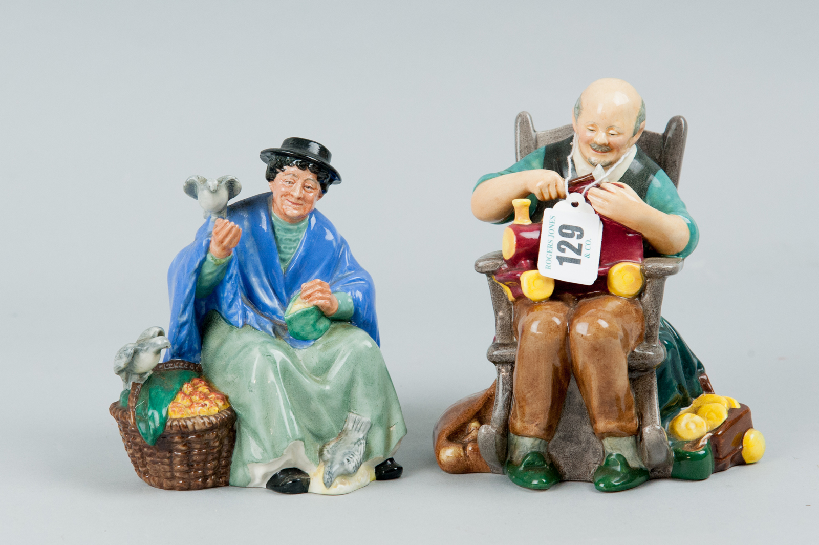 A Royal Doulton figurine `Tuppence a Bag` HN2320 along with a Royal Doulton figurine `The Toymaker`