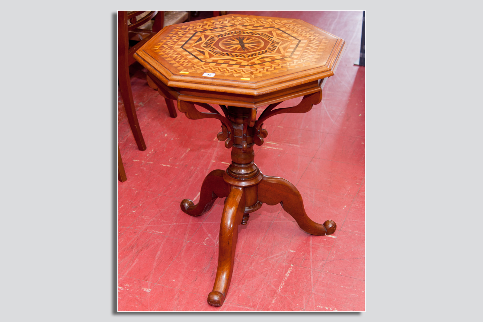 A very good quality marquetry topped pedestal table, a profusely decorated segmented top with a