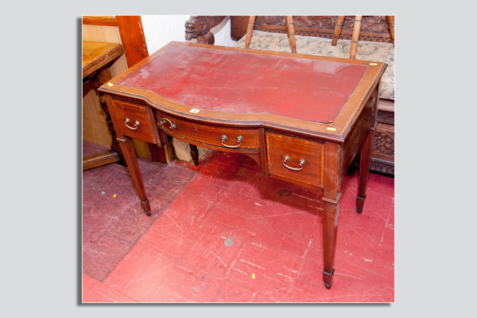 An Edwardian mahogany and crossbanded lady`s desk having a bow front with drawer and a box drawer