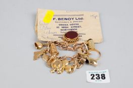 A nine carat gold bracelet of large wide links and having a bloodstone swivel fob and approximately