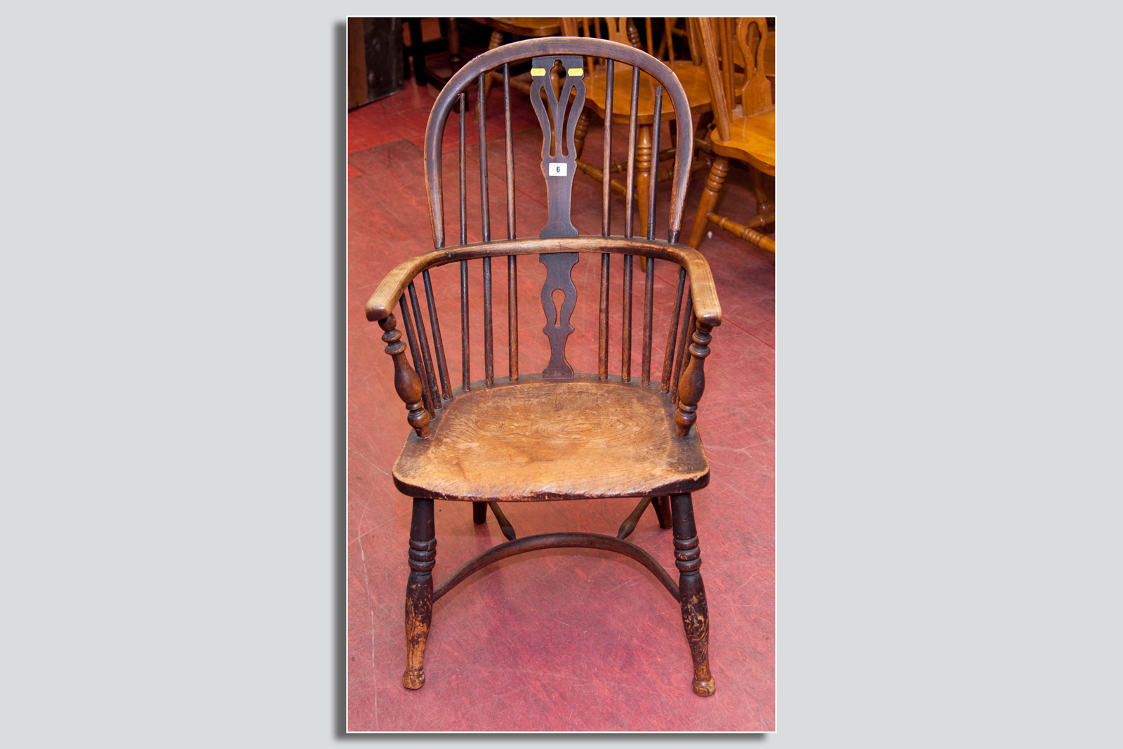 An ash and elm Windsor armchair with a crinoline stretcher and a pierced splatback, 35 x 22 ins (89