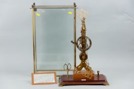 A reproduction single fusee scissor skeleton clock, the silvered chapter ring with the name `Thomas