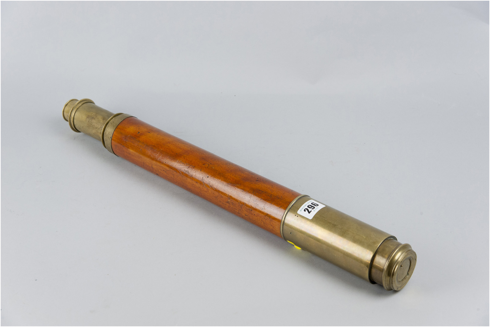 A mahogany and brass single draw night and day telescope by C West, London