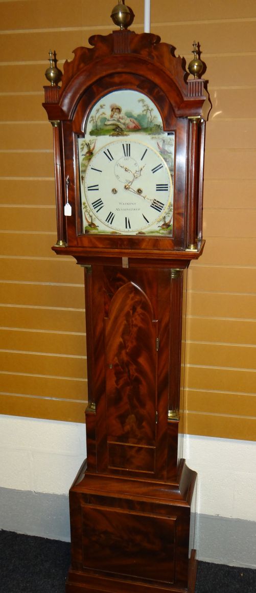 An eight day Essex longcase clock with pillared arched hood and decorated with brass finials, the