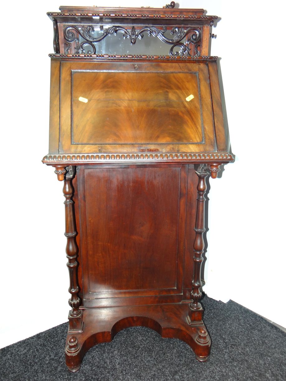 A Victorian mahogany standing vanity cabinet, the sloped front with velvet insert reverse and