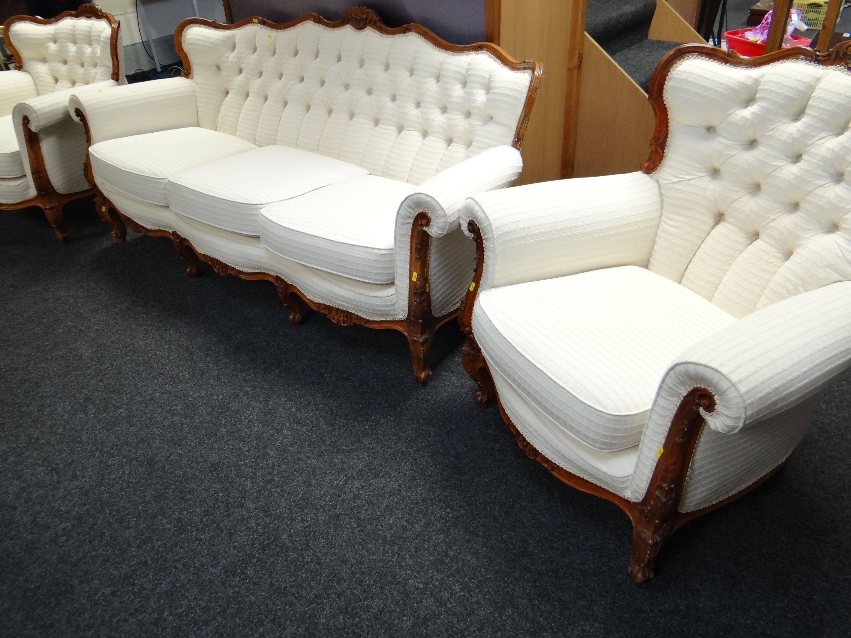 An H & L Epstein French-style three piece suite of carved and shapely form in cream chequered