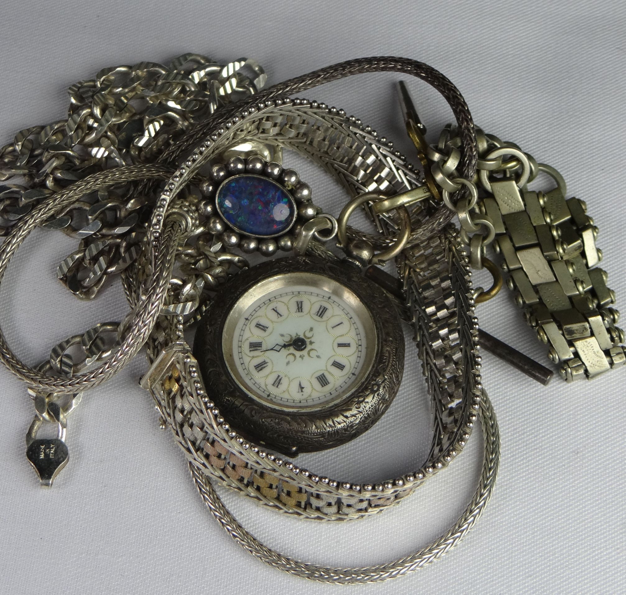 A parcel of mixed silver jewellery including a necklace with harlequin-opal pendant, fob watch etc