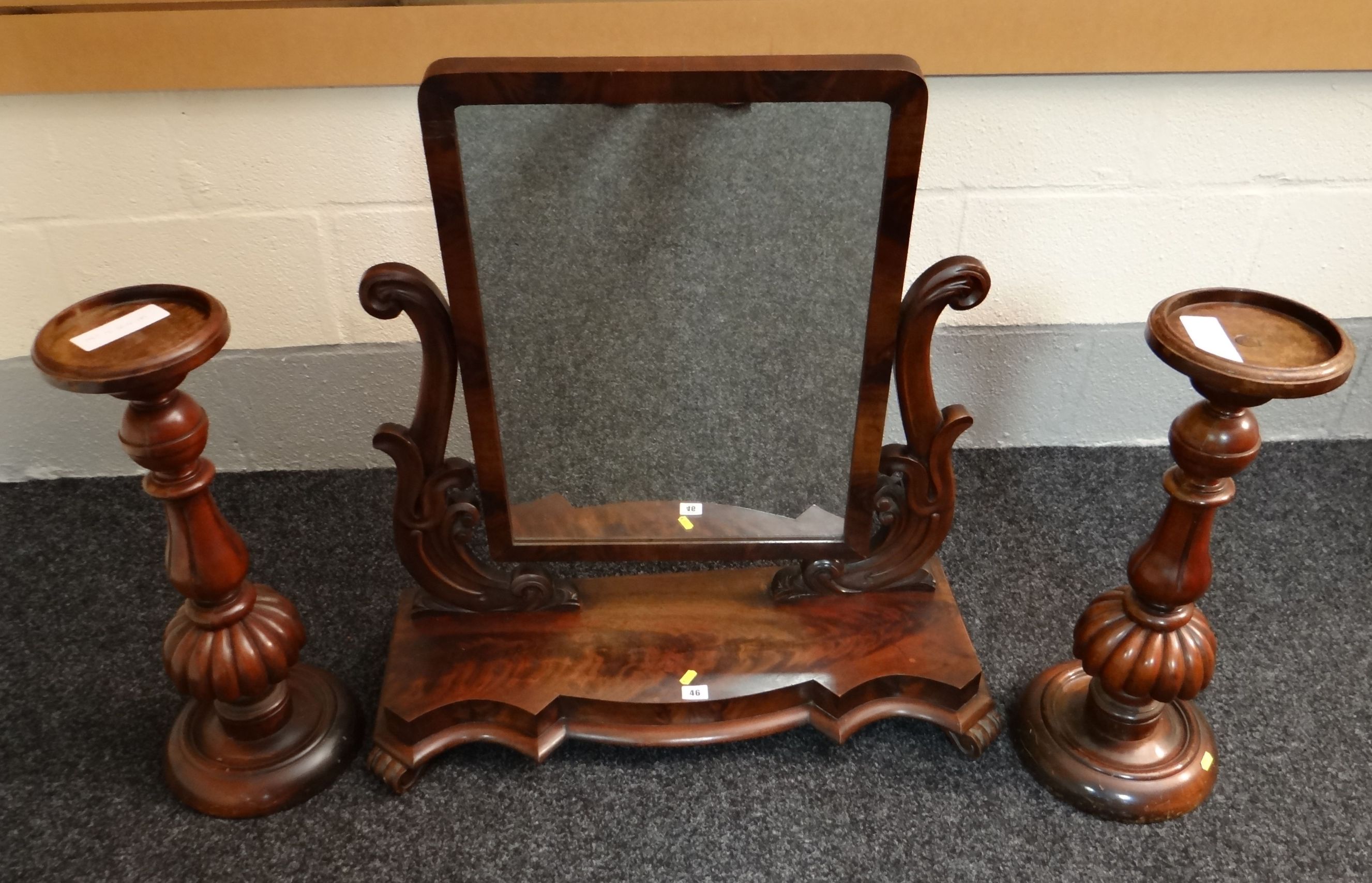 A large Victorian mahogany swing toilet mirror, together with a pair of mahogany planter pedestals