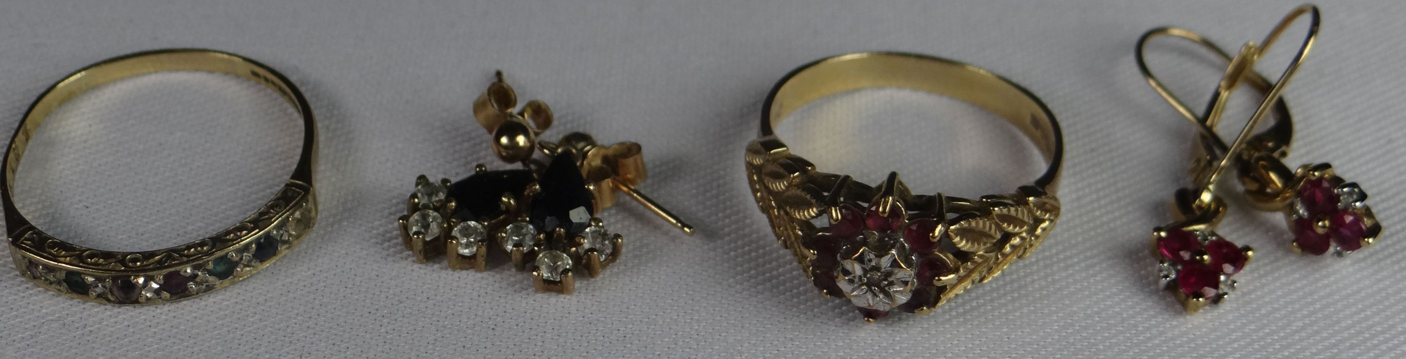 Two 9ct yellow gold rings, one with small combination stones, the other with small ruby and