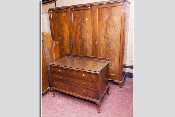 An early 20th Century mahogany triple door wardrobe, the centre part having sliding drawers and