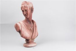 A terracotta bust of a classical lady, head to one side, 18.5 ins (47 cms) long