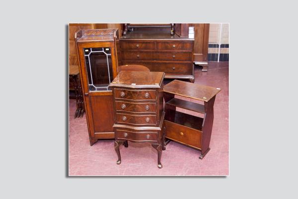 A reproduction serpentine front narrow four drawer chest for restoration, a polished coffee table/