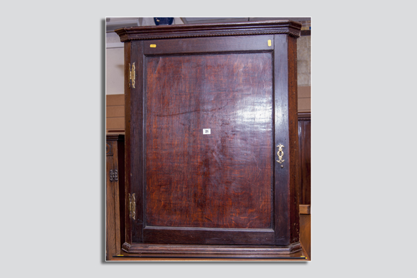 Antique oak single door hanging corner cupboard with two interior shaped shelves, 28 ins (71 cms)