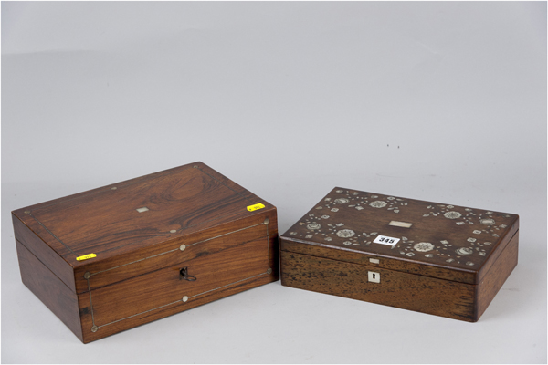 A rosewood oblong box with fine mother of pearl floral inlay to the flat top lid and having four