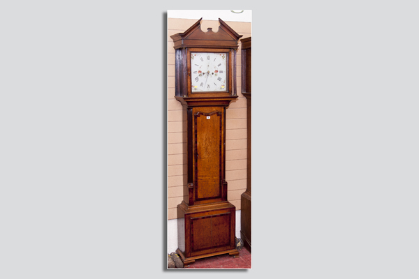 A late 18th/early 19th Century oak and mahogany crossbanded longcase clock, the square hood having