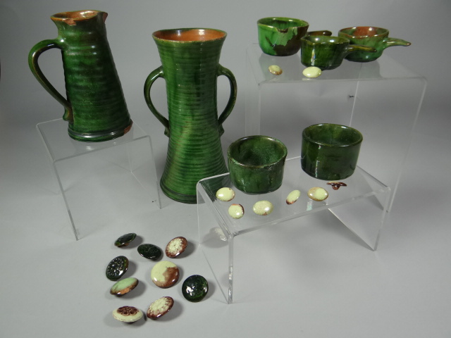 A group of seven Devon earthenware pottery items by Edwin Beer Fishley of Fremington, all in green