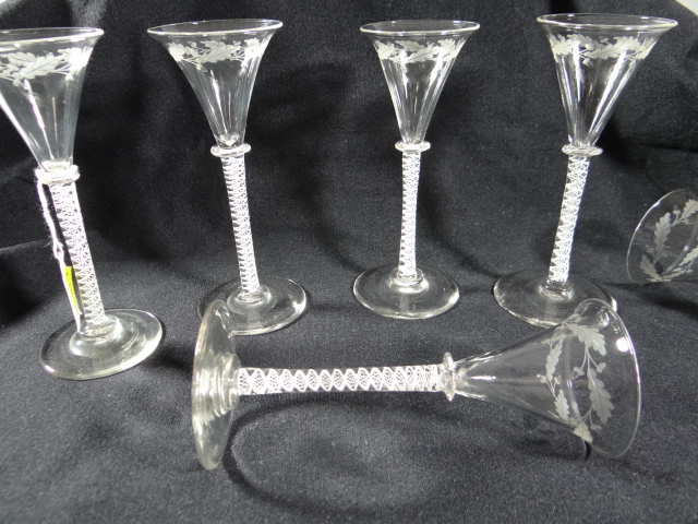 A set of six double opaque twist English ale glasses with long knopped stems and of trumpet form,