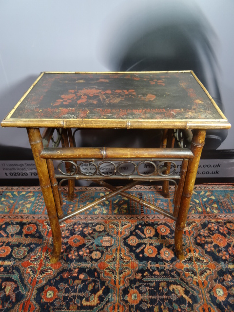 A bamboo rectangular table circa 1900 with lacquered top decorated with birds