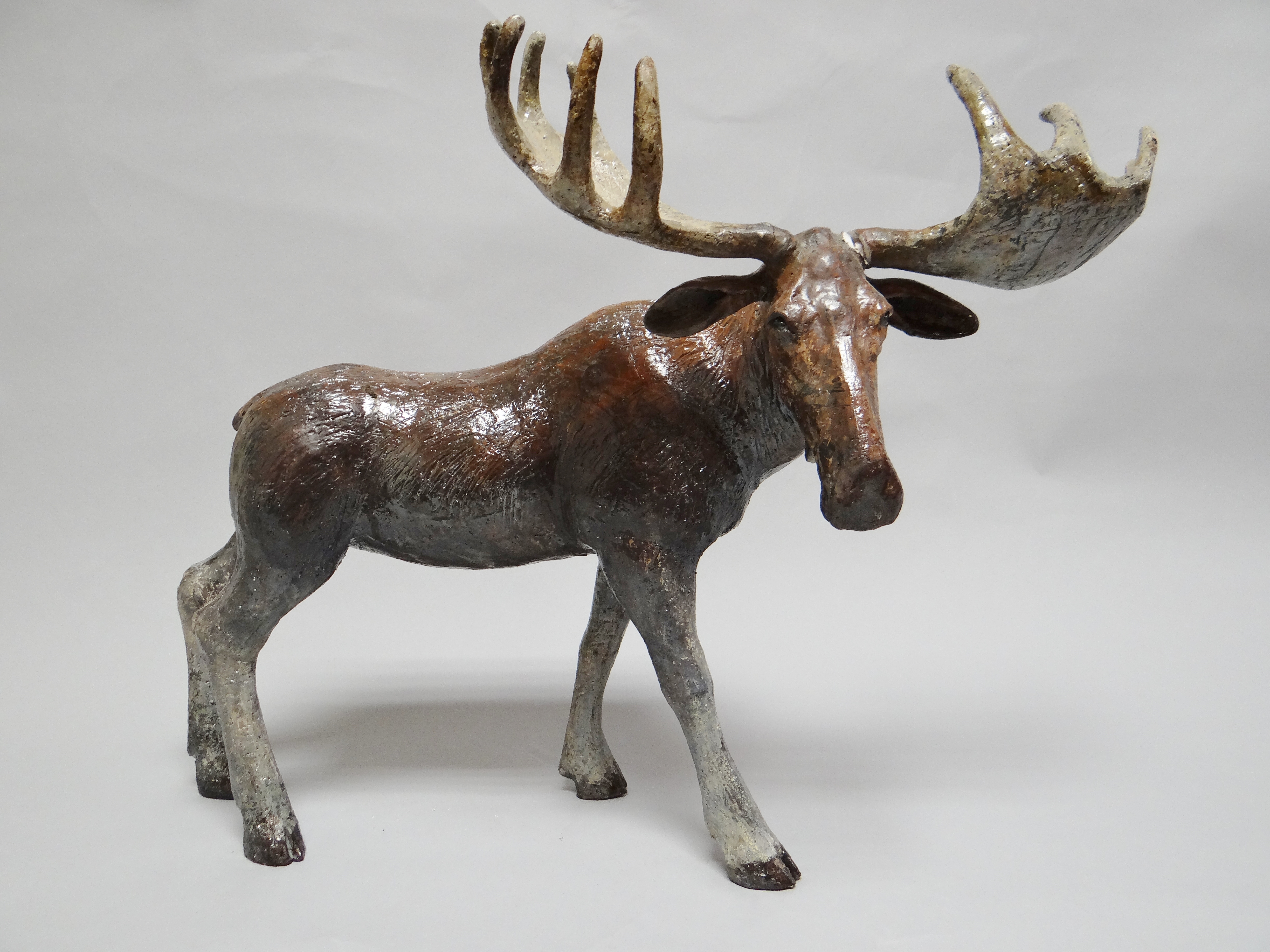 SALLIE WAKLEY ceramic - raku fired ceramic moose, A/F, 16 x 22 ins (41 x 56 cms)