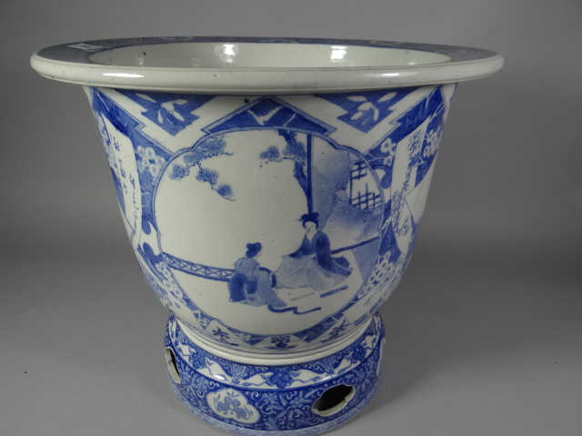 A substantial late nineteenth century blue and white Japanese ceramic jardiniere, unusually raised