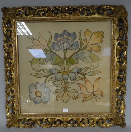 A square floral needlework panel in a good Rococo style gilt wood open-work frame carved with leaf