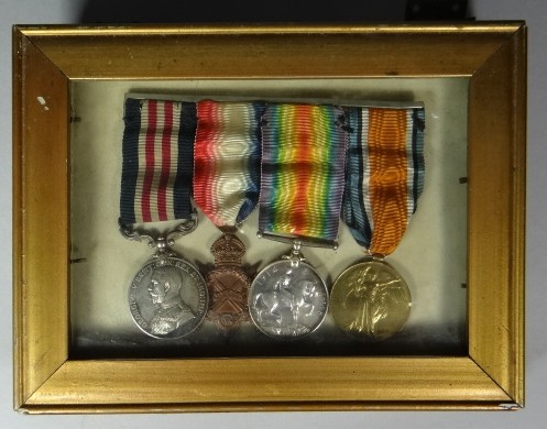 A Military Medal and 1914-15 trio all to 42271 Pte. J. Thomas, R.A.M.C. in frame previously kept by