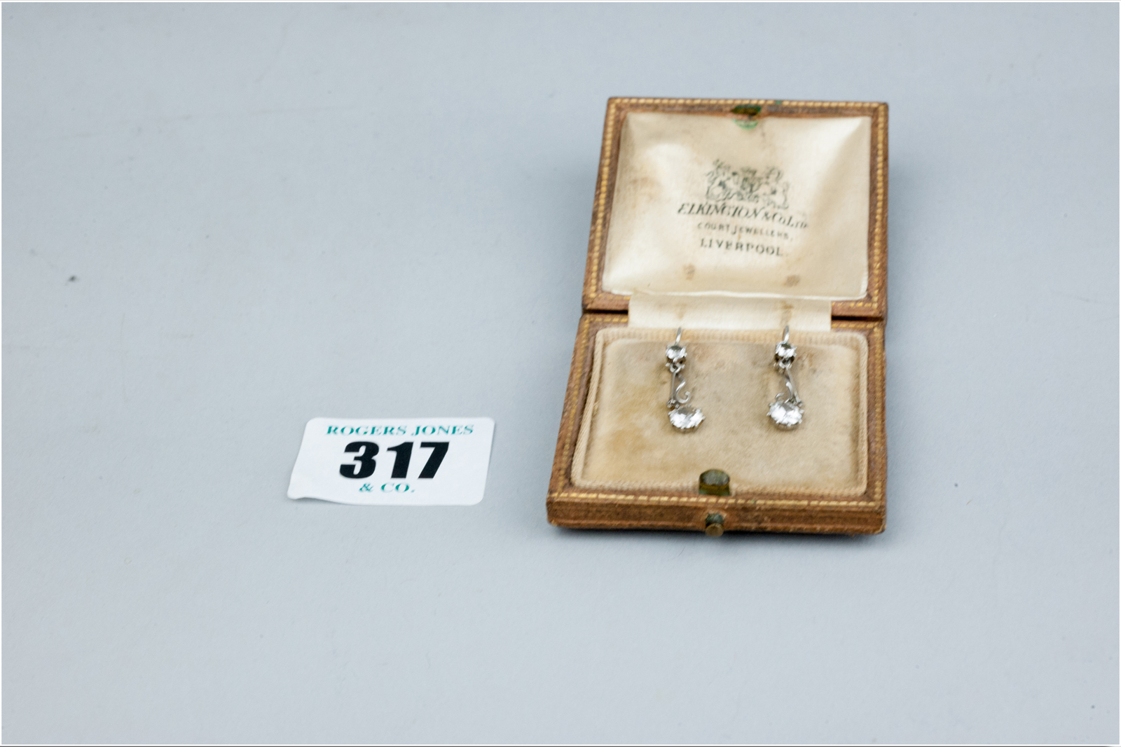 A pair of round cut diamond white metal set hoop earrings, each diamond of visual estimate 0.5 carat