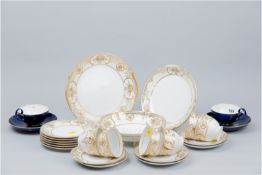 Twenty one pieces of Noritake teaware decorated in an ivory and gilt floral pattern and a pair of