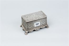 Trinket box - an oblong silver trinket box with slightly domed lid and having all over floral and