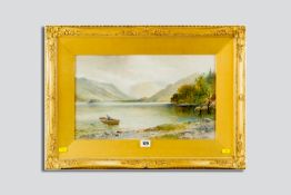 E A STOCK watercolour - lake scene with fisherman and boat, signed, 10.5 x 17.75 ins (27 x 45 cms)