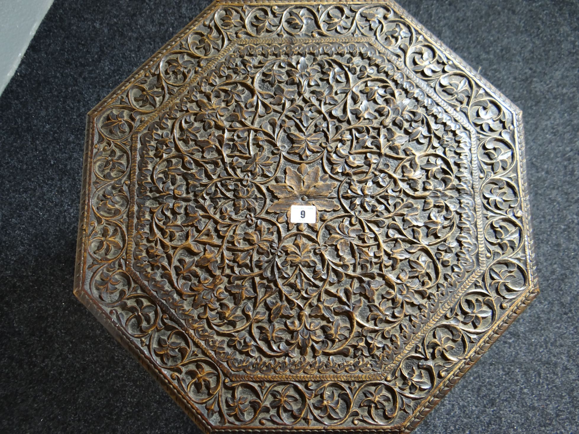 An Indian octagonal carved and pierce-work table, the top profusely carved with foliage and the - Bild 2 aus 2