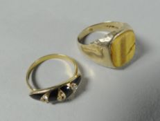 Two gold / yellow metal rings