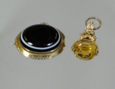 A Victorian yellow gold seal-fob (damaged) together with a Victorian mourning locket of hair with