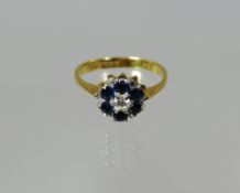 An 18ct yellow gold sapphire and diamond floral ring