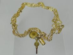 An unmarked but believed 9ct yellow gold watch chain with charm, hair locket and watch-key