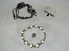 A parcel of mourning jewellery including oval filigree brooch, jet beads etc
