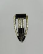 An arrow shaped Art Deco design brooch of tiny diamonds and believed black sapphires on a 935