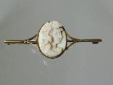 A 9ct bar-brooch with centre oval cameo portrait