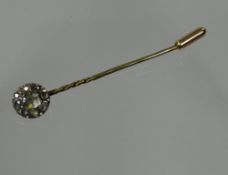 A 9ct yellow gold stock-pin with cluster of rough uncut diamonds