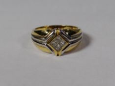 A modern 18ct yellow and white gold ring with four centre diamonds, 6.8gms