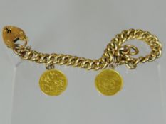 A 9ct yellow gold link bracelet with heart-shaped padlock and two gold coins attached - a 1902 half