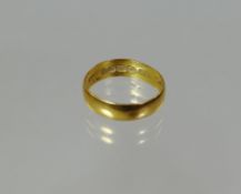 A 22ct yellow gold band ring, 3.5gms