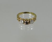 A 9ct yellow gold champagne and white diamond trio ring with scroll design to shoulders