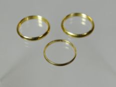 Three unmarked yellow metal, believed gold band rings, 3.8gms