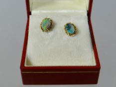 A pair of 14k yellow gold and Australian opal earrings