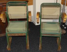 A set of nine green canvas and green painted metal stacking chairs in the Wimbledon style (