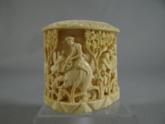 An African ivory carved cylindrical brush-pot with all-round scene of hunters on elephant-back